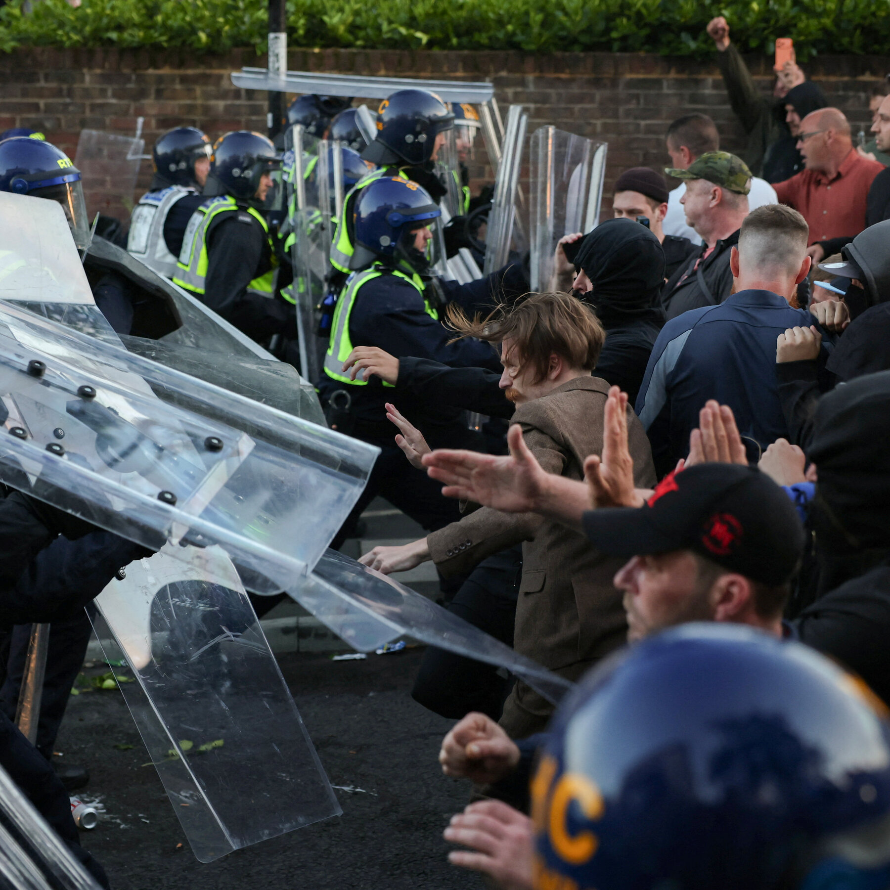 Violent U.K. protests over murder case injure eleven officers, cabinet minister decries