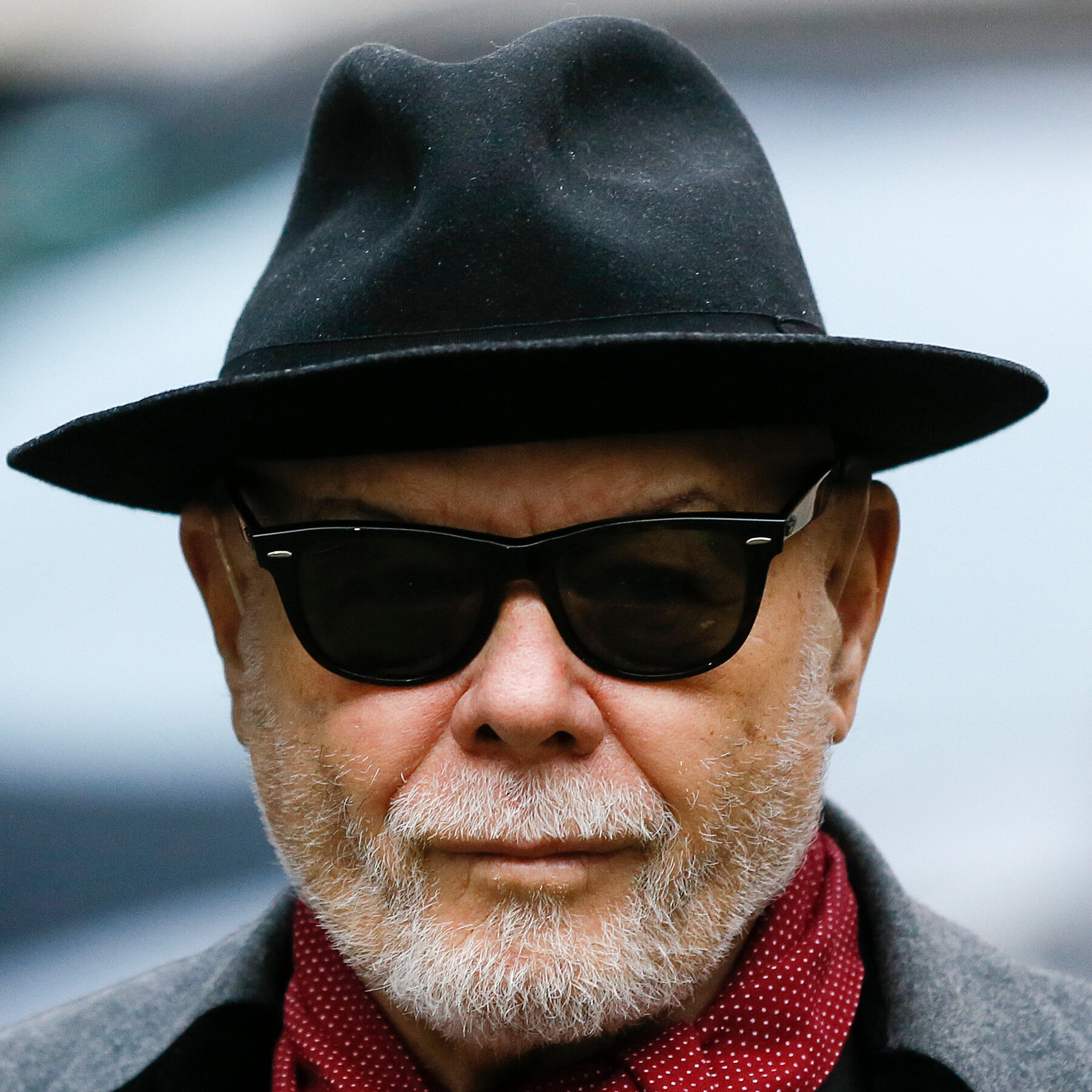 British prosecutors charge former singer Gary Glitter with multiple indecent assault offenses from the 1970s