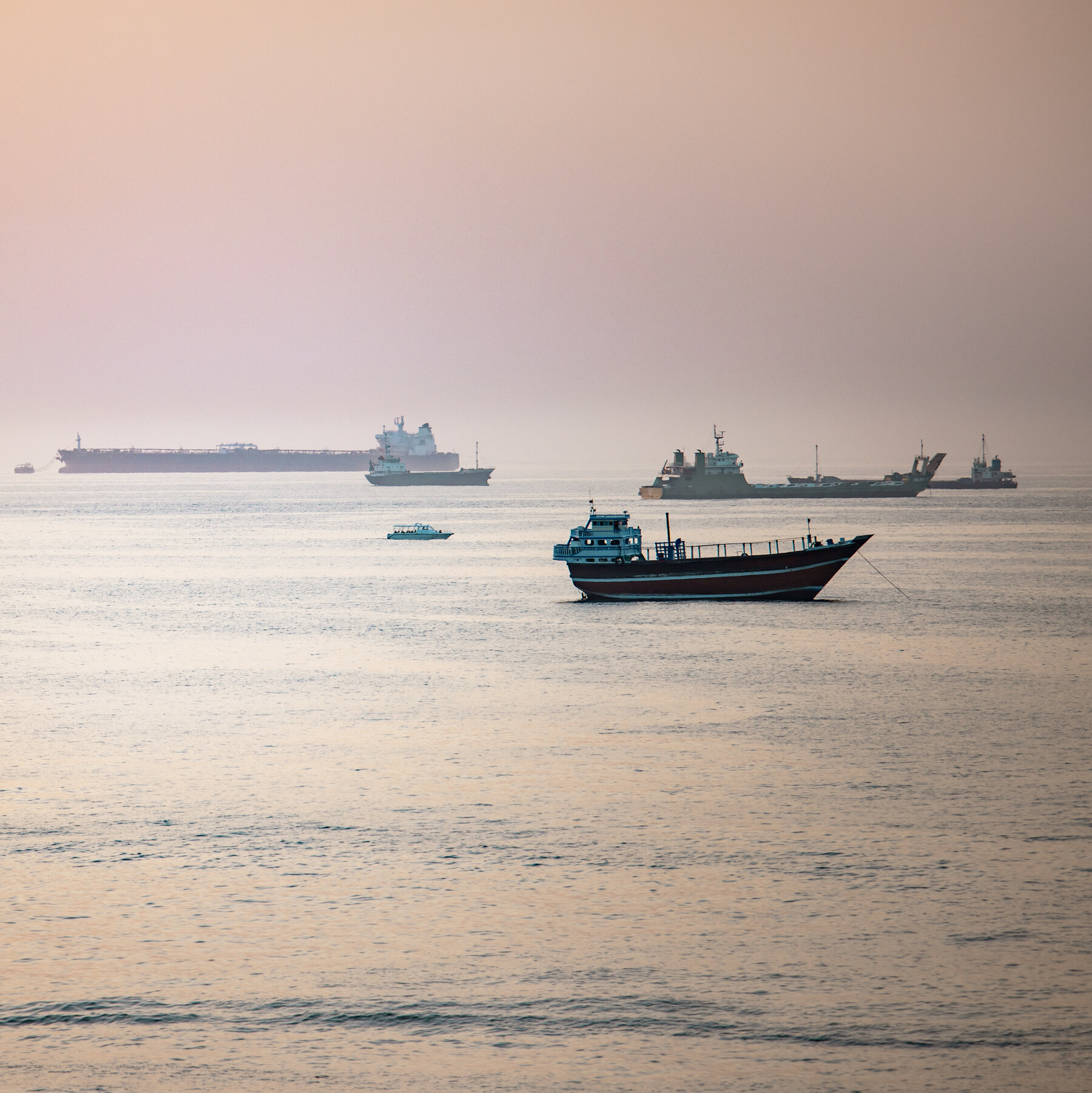 Iranian missiles hit two commercial vessels in Strait of Hormuz, raising concerns over U.S.-Iran cease-fire