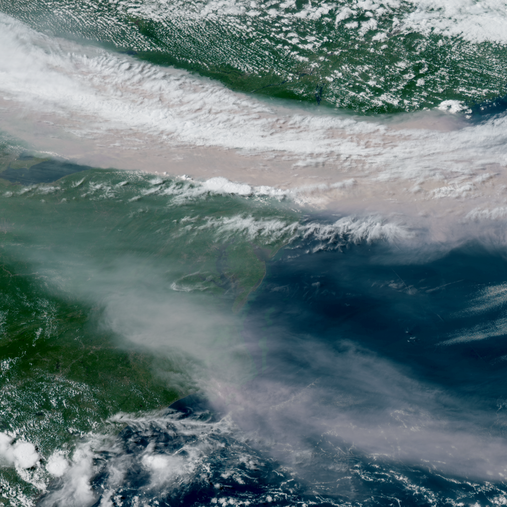 Satellite Images Reveal Expansive Wildfire Smoke Across North America